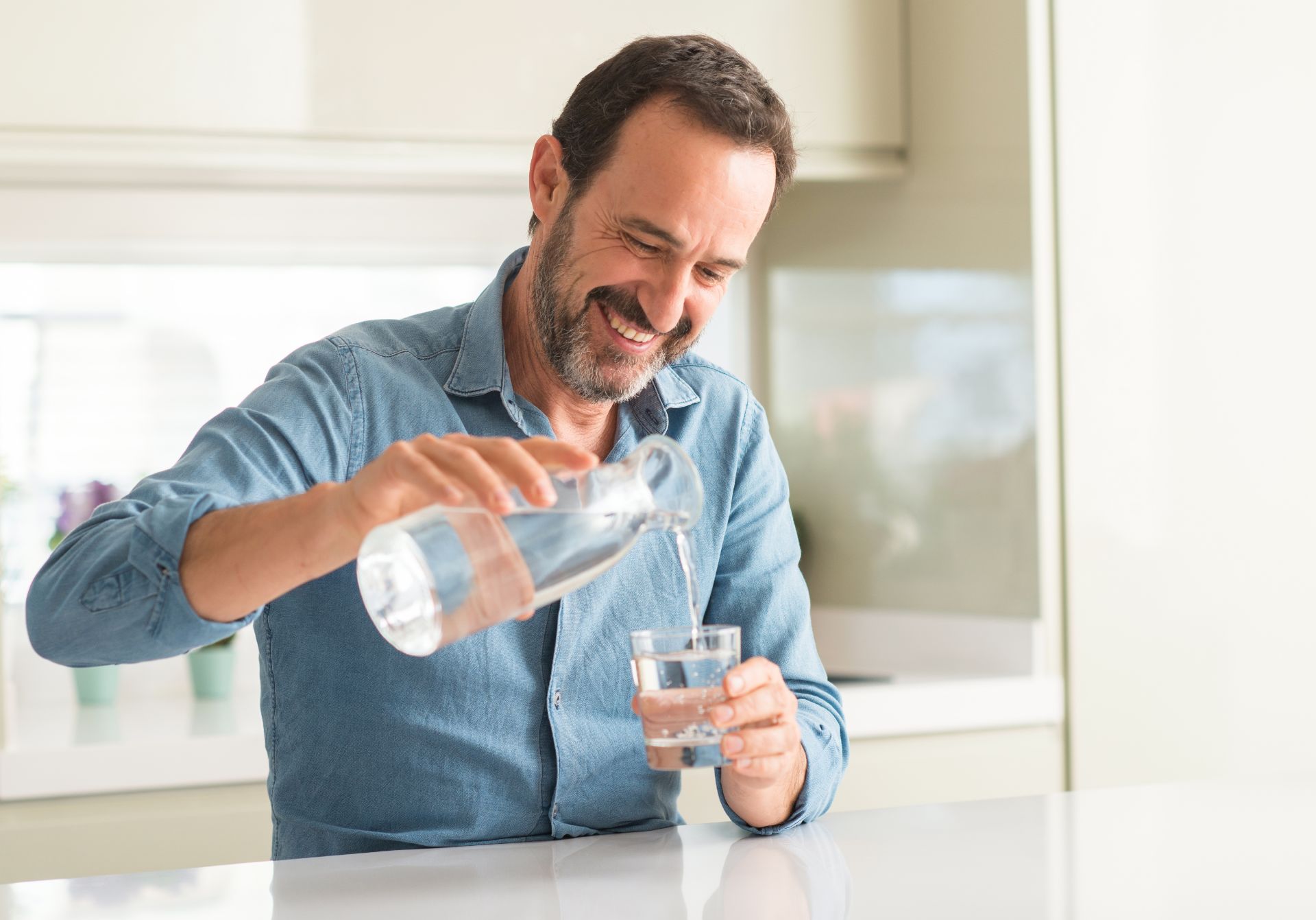 man drinking glass of water.jpg