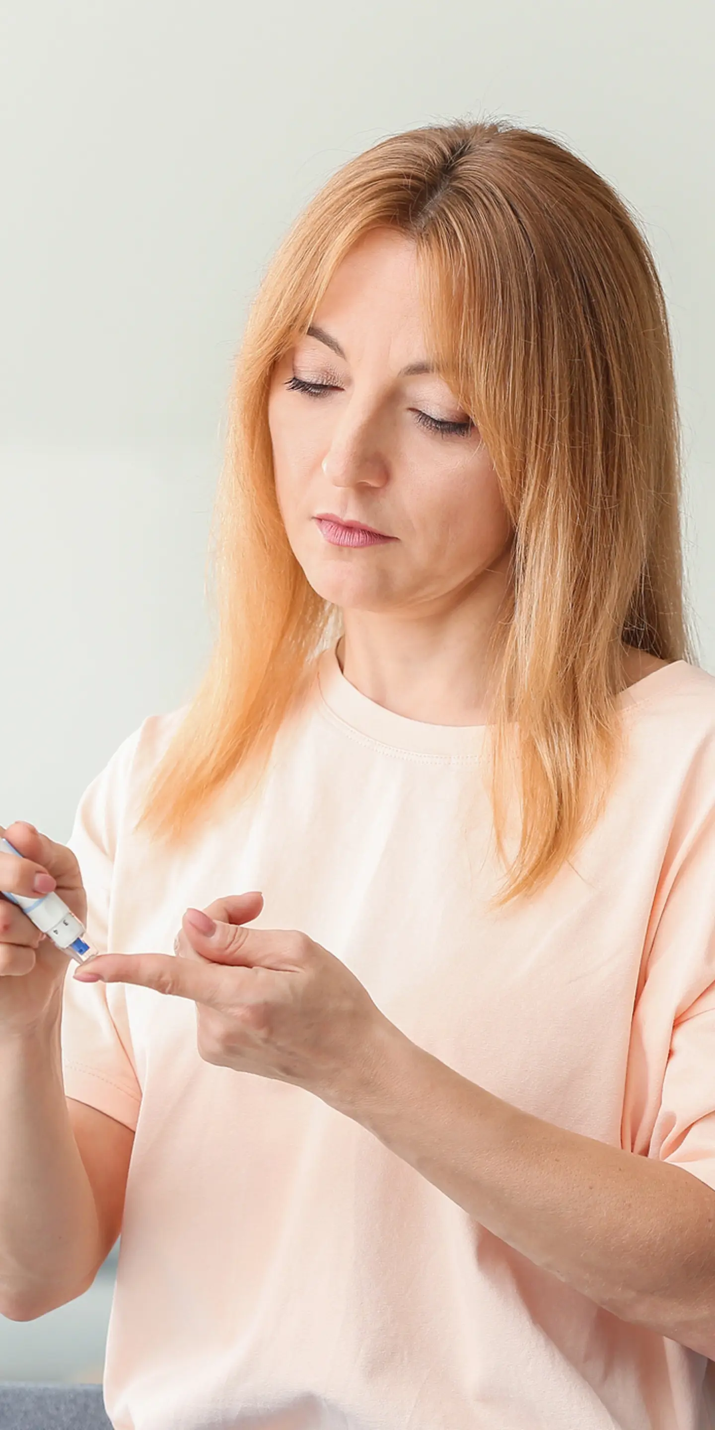 Diabetic Woman Taking Blood Sample